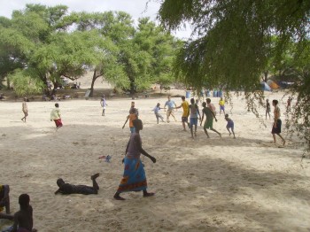 Students playing soccer with the locals in the dried up Il Eriet river in 2007.
