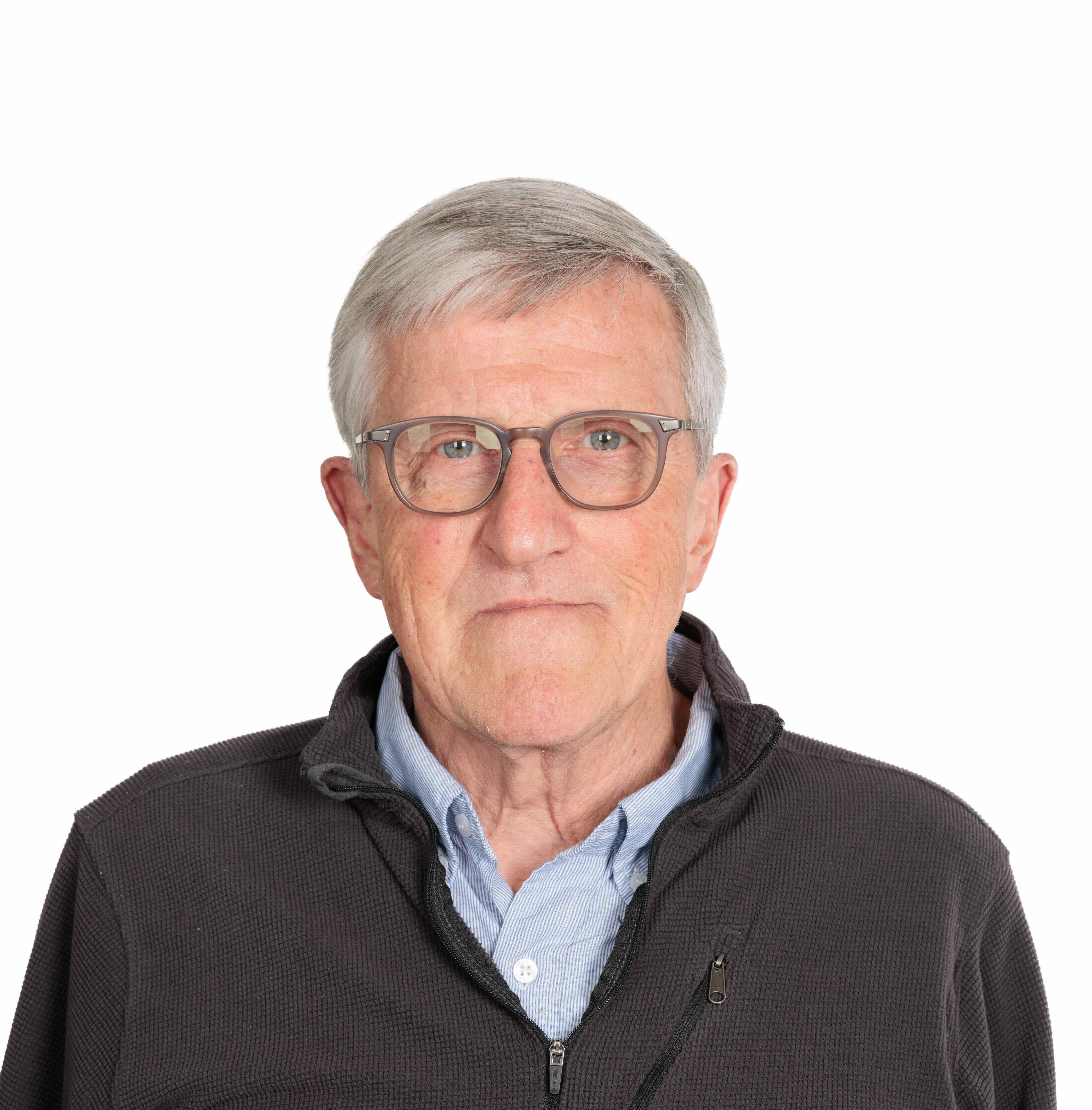 Dr. Bernard Wood is a white man with short grey hair and glasses.