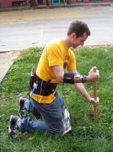Kevin Hatala demonstrates the use of a digging stick while connected to pressure sensors