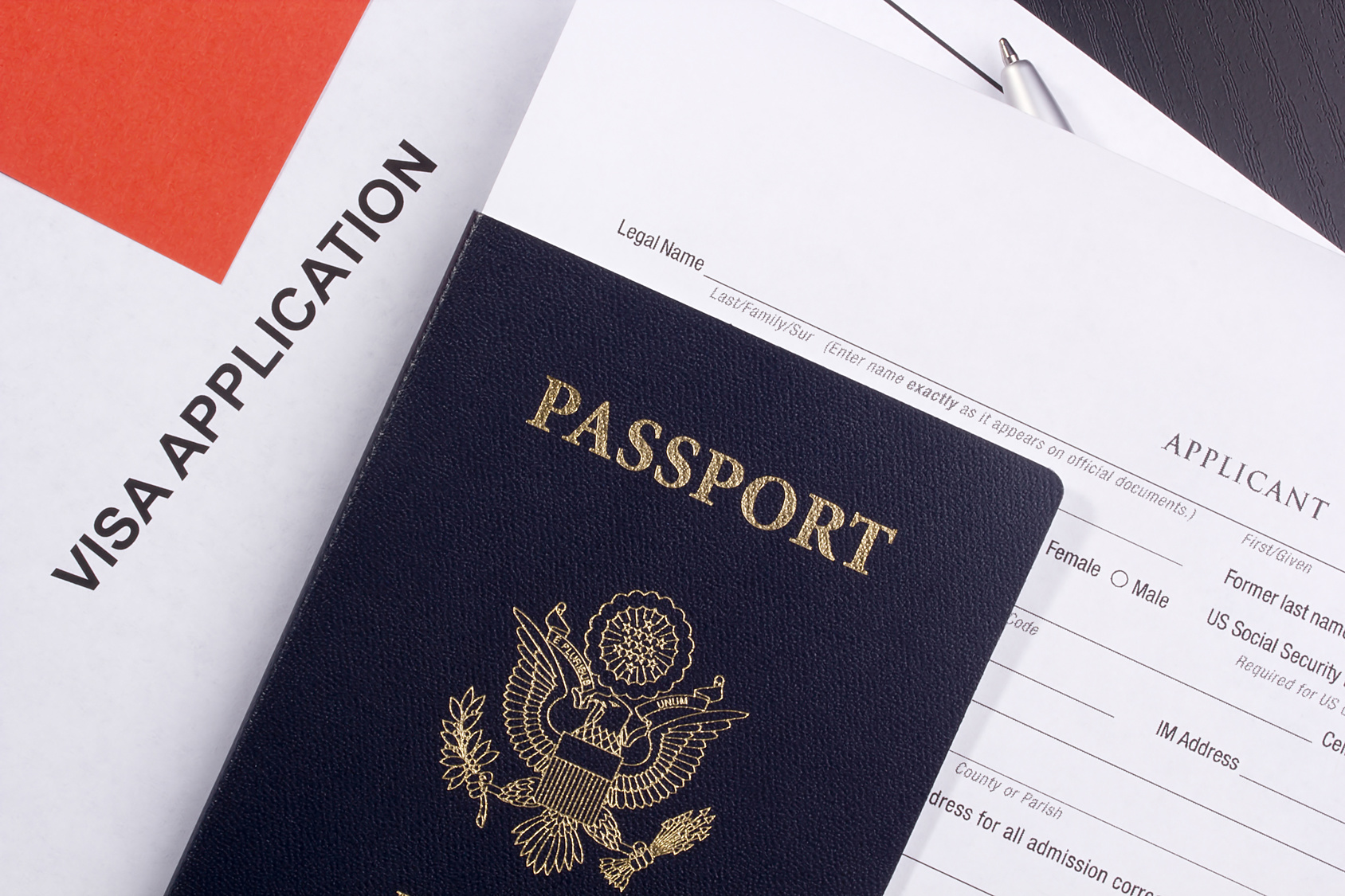 US passport on top of a visa application